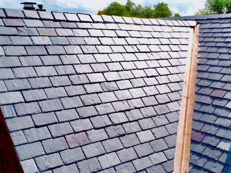 a slate roof displaying classic coloration with copper valleys